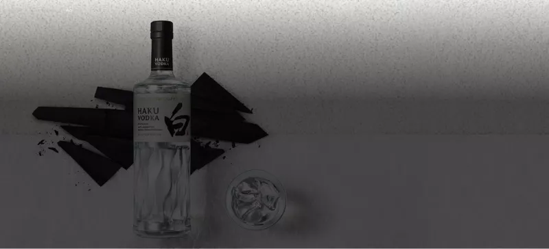 Bottle of Haku Vodka with black ink artwork