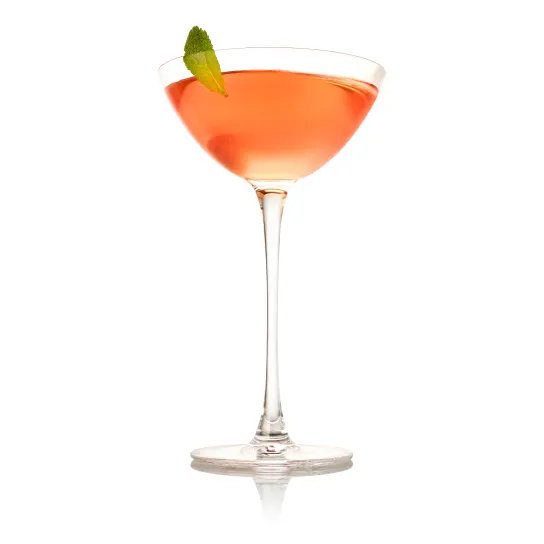 Haku Vodka Lychee Martini in coup glass with green leaf garnish