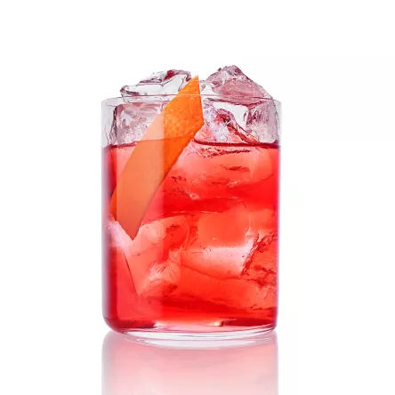 Roku Negroni cocktail on ice with large orange twist