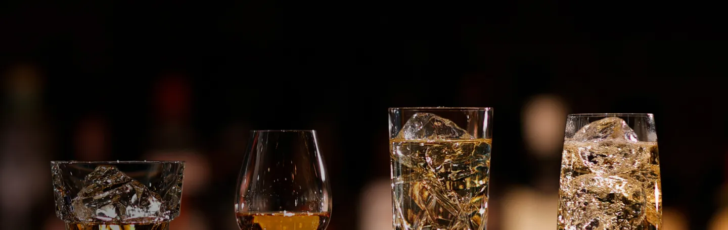 Whisky pours into 4 different glasses