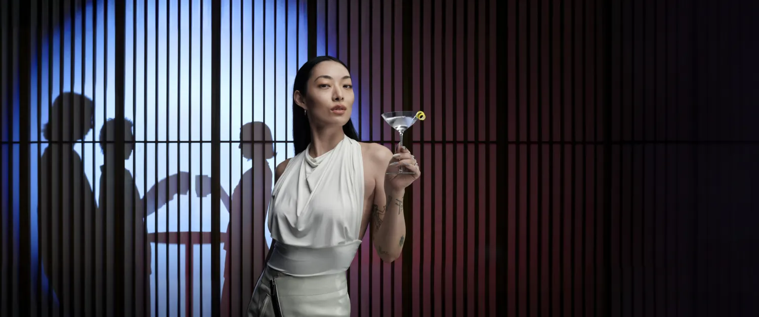 Rina holding the vodka glass
