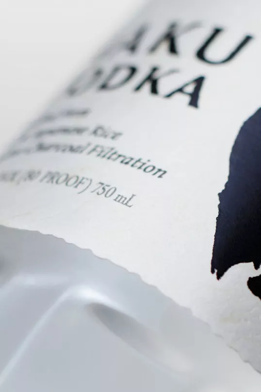close up view of Haku Vodka label with black ink calligraphy