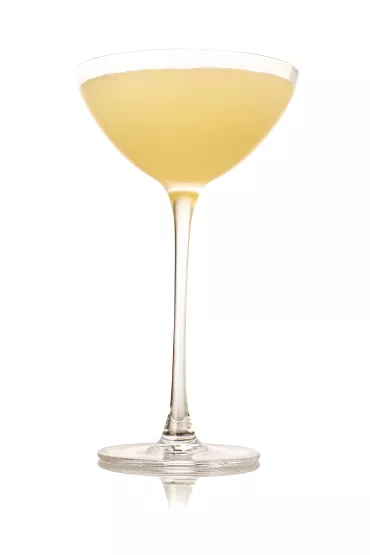 Coup glass filled with Haku Yuzu Martini cocktail