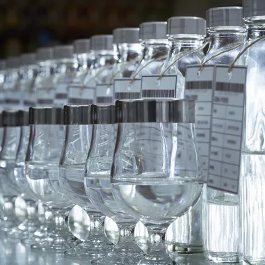 Bottles of clear Japanese spirits ready for tasting and blending