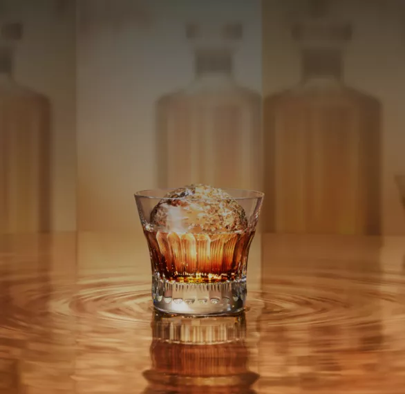 Old fashioned glass of House of Suntory whisky over large round hand-cut ice cube