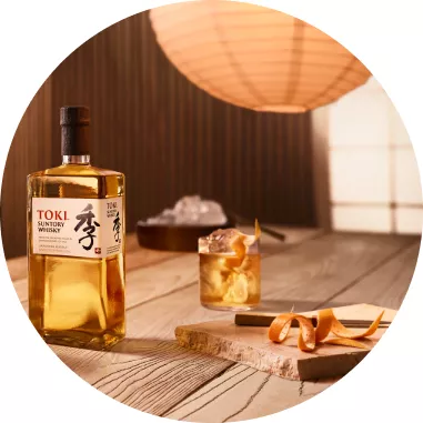 Toki Whisky bottle next to a Japanese old fashioned