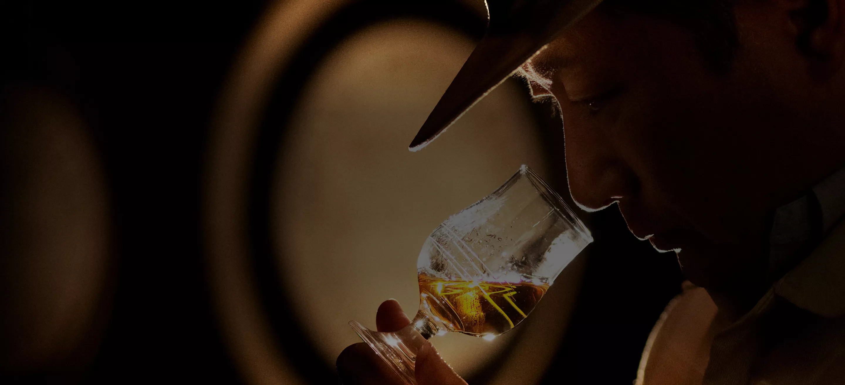 Homepage hero, man smelling glass of whisky 