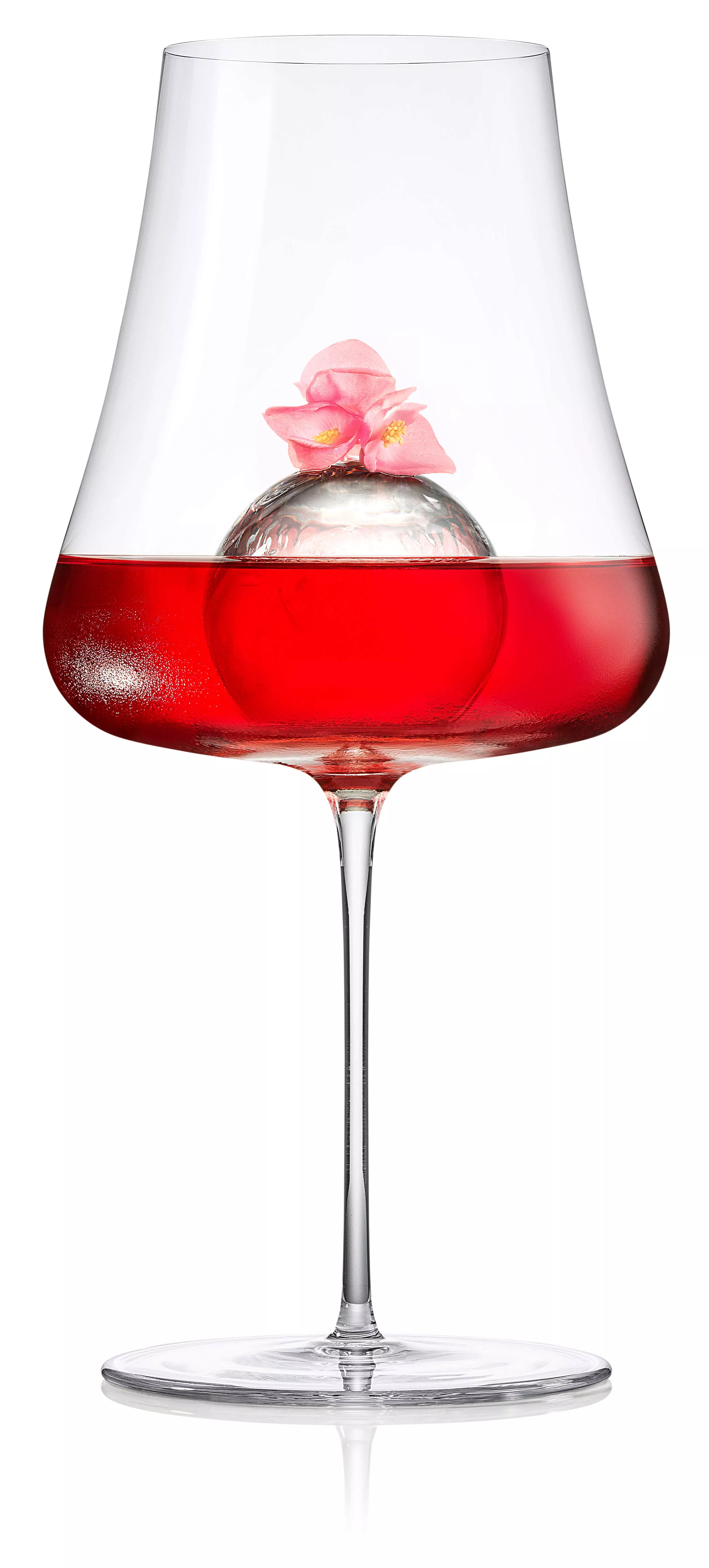 Roku Sakura Aperitif served in a wine glass with Sakura garish