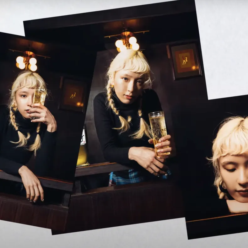 A beautiful girl holding a glass of toki whisky.