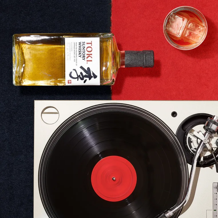 A bottle of toki alongside with an old retro case.