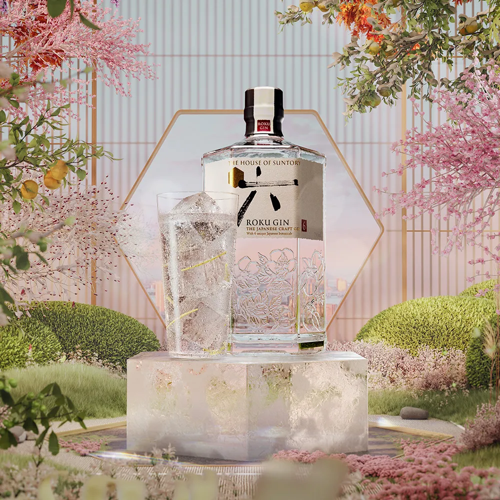 Roku Gin bottle and it's cocktail glass in a garden