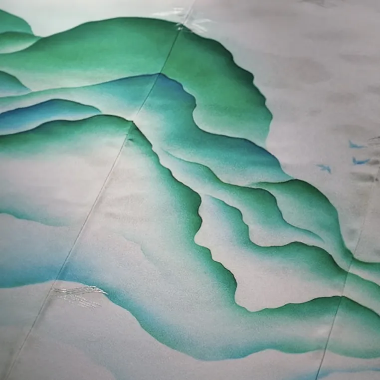 A serene watercolor painting depicting gentle waves flowing across a white canvas, showcasing soft blues and greens.