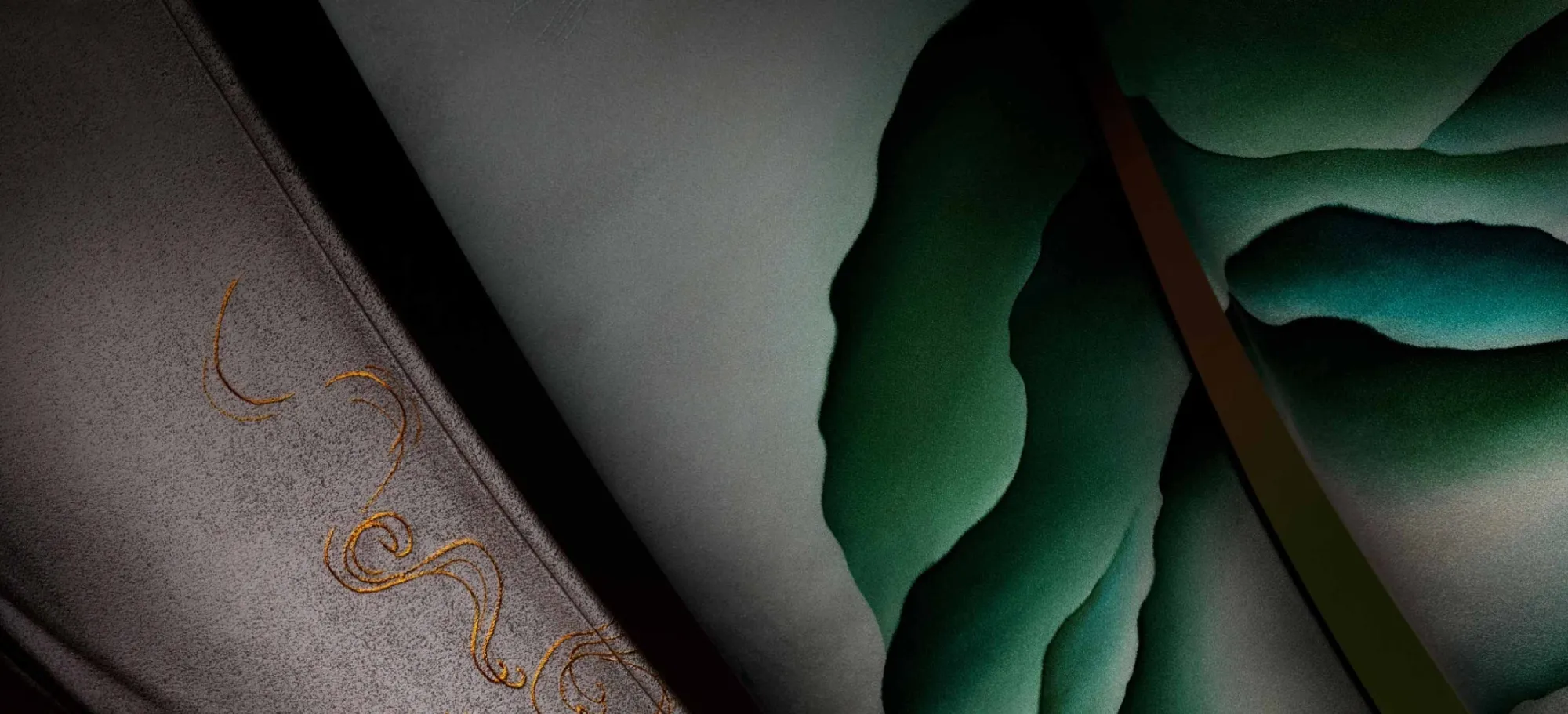 A close-up view of a painting featuring an intricate design in shades of green and gold, highlighting its artistic details.