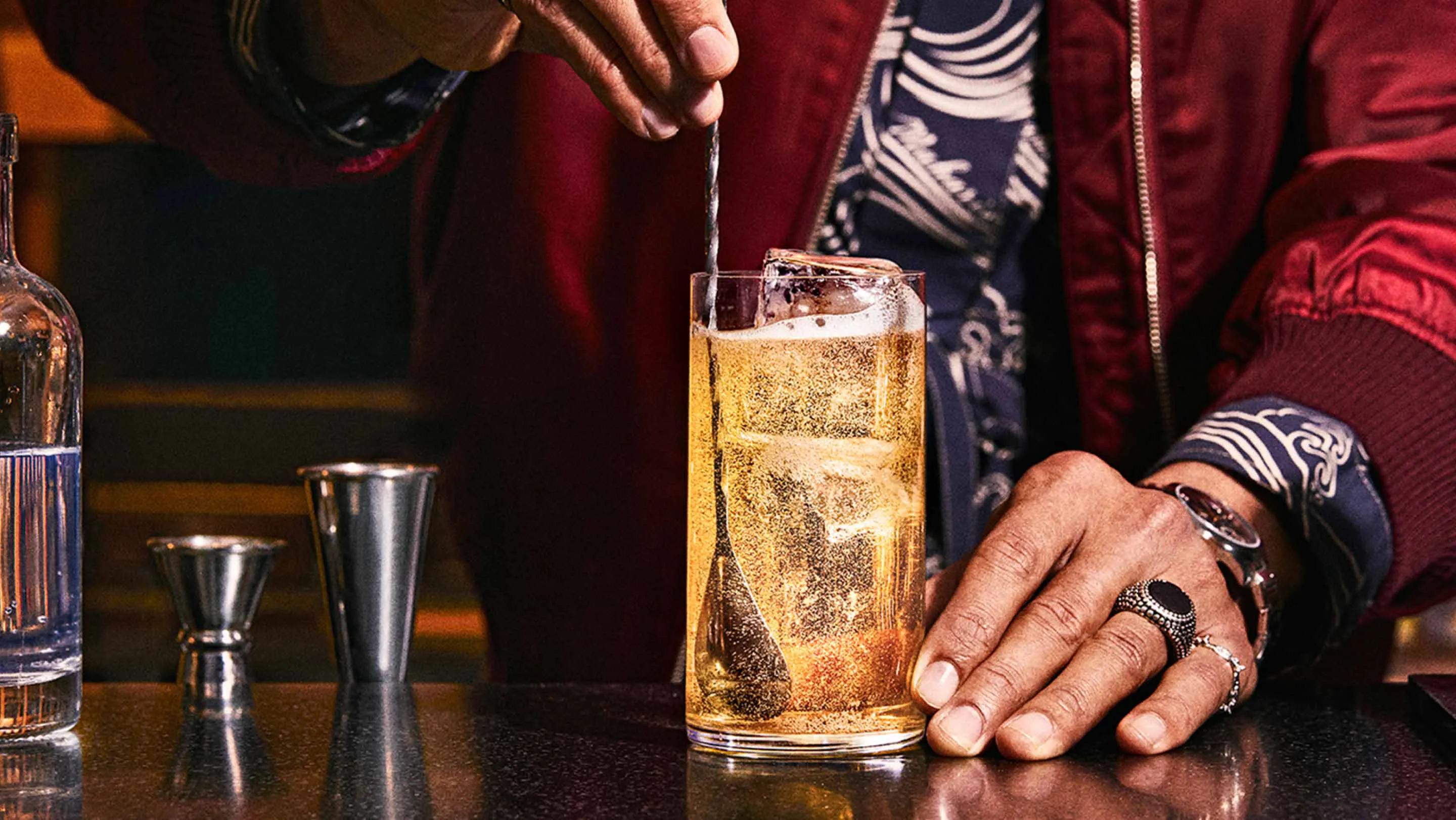 a person is steraing cocktail