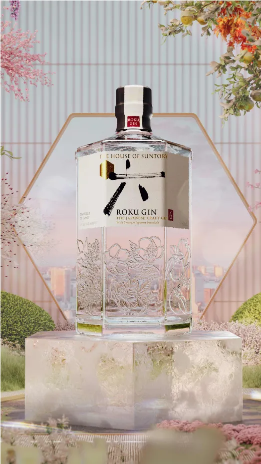Bottle of Roku Gin on an ice block against a floral background.
