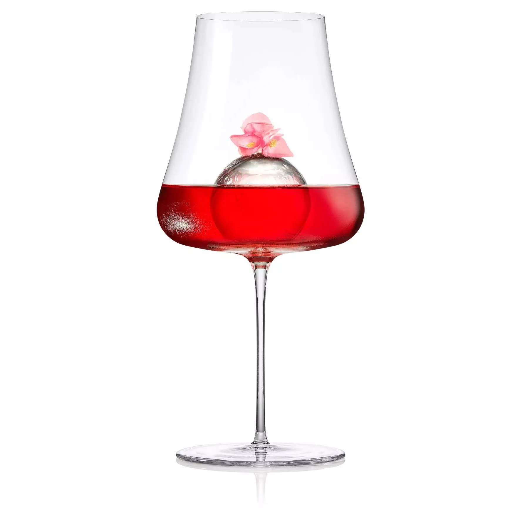 Roku Sakura Aperitif served in a wine glass with Sakura garish