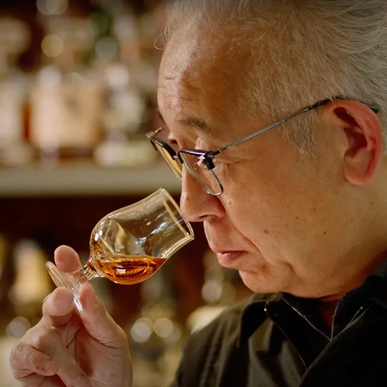 Shinji smelling whisky from whisky glass