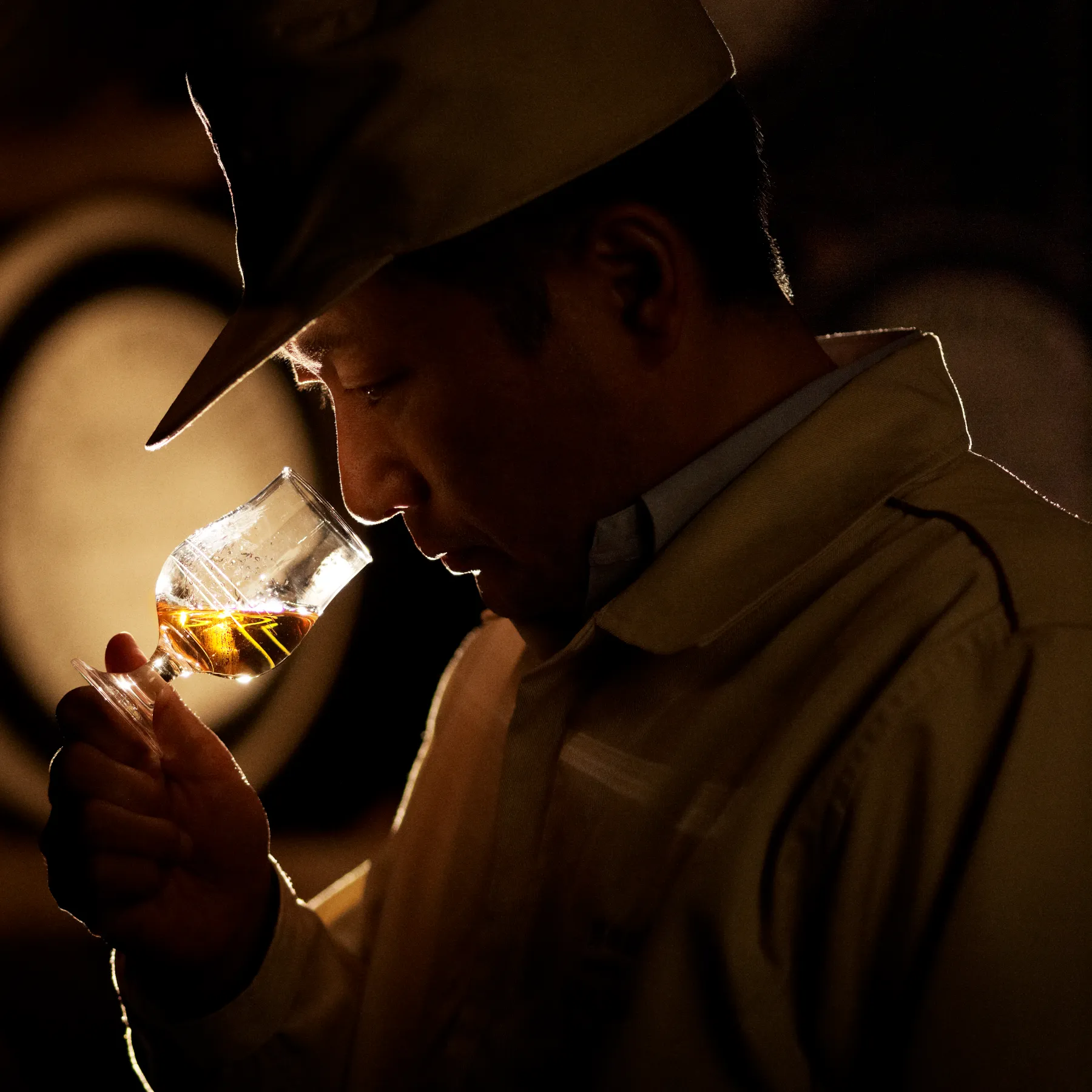 worker smell whisky from whisky glass