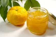 yuzu with a jar full with yuzu pulp