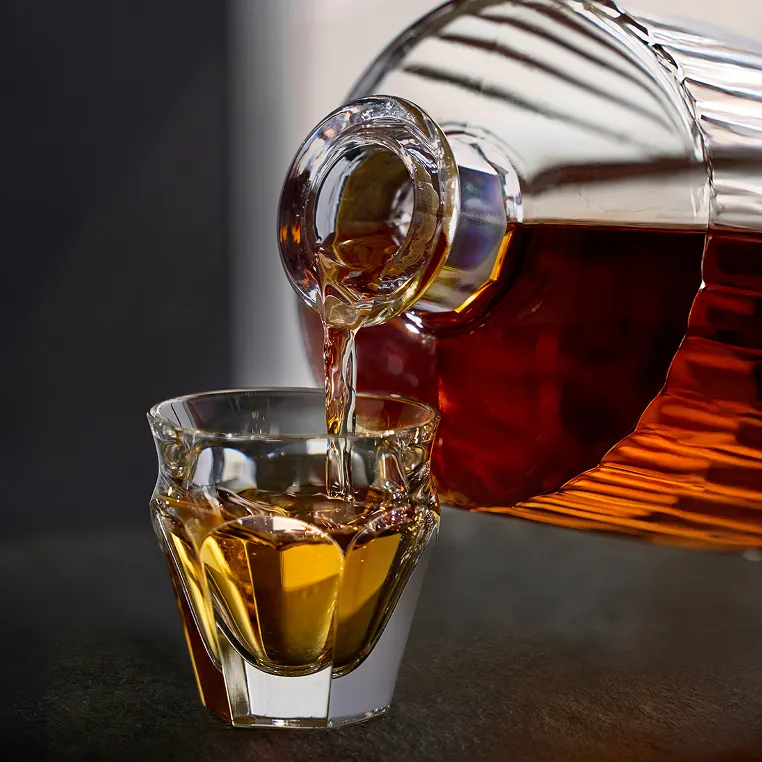 whisky is poaring into whisky glass